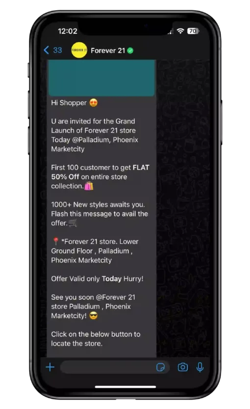 A mobile phone displaying a WhatsApp message from Forever 21 promoting their Grand Launch sale
